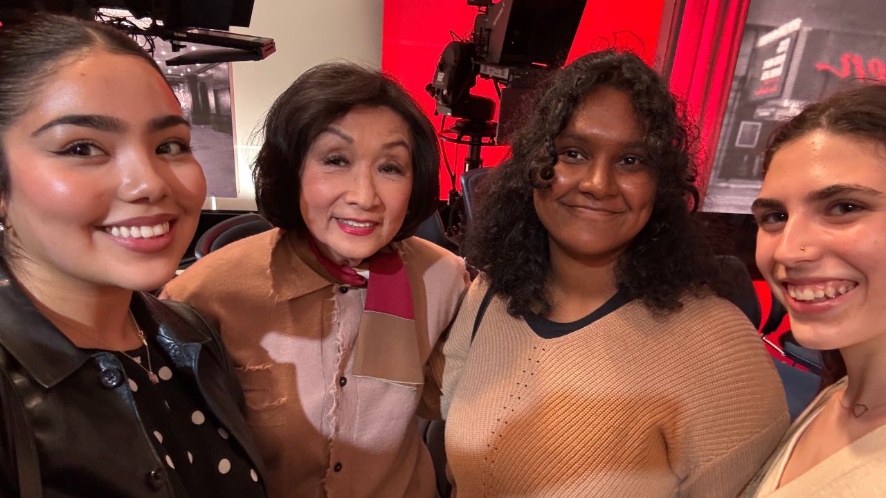 A group of students pose with Connie Chung at CNN's Good Night and Good Luck broadcast