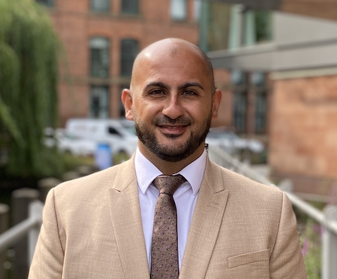 Bamo Nouri Headshot with building in background