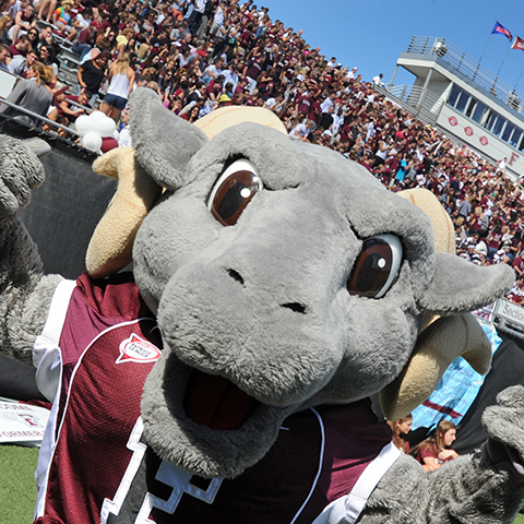 The Fordham Ram mascot cheers on the team.