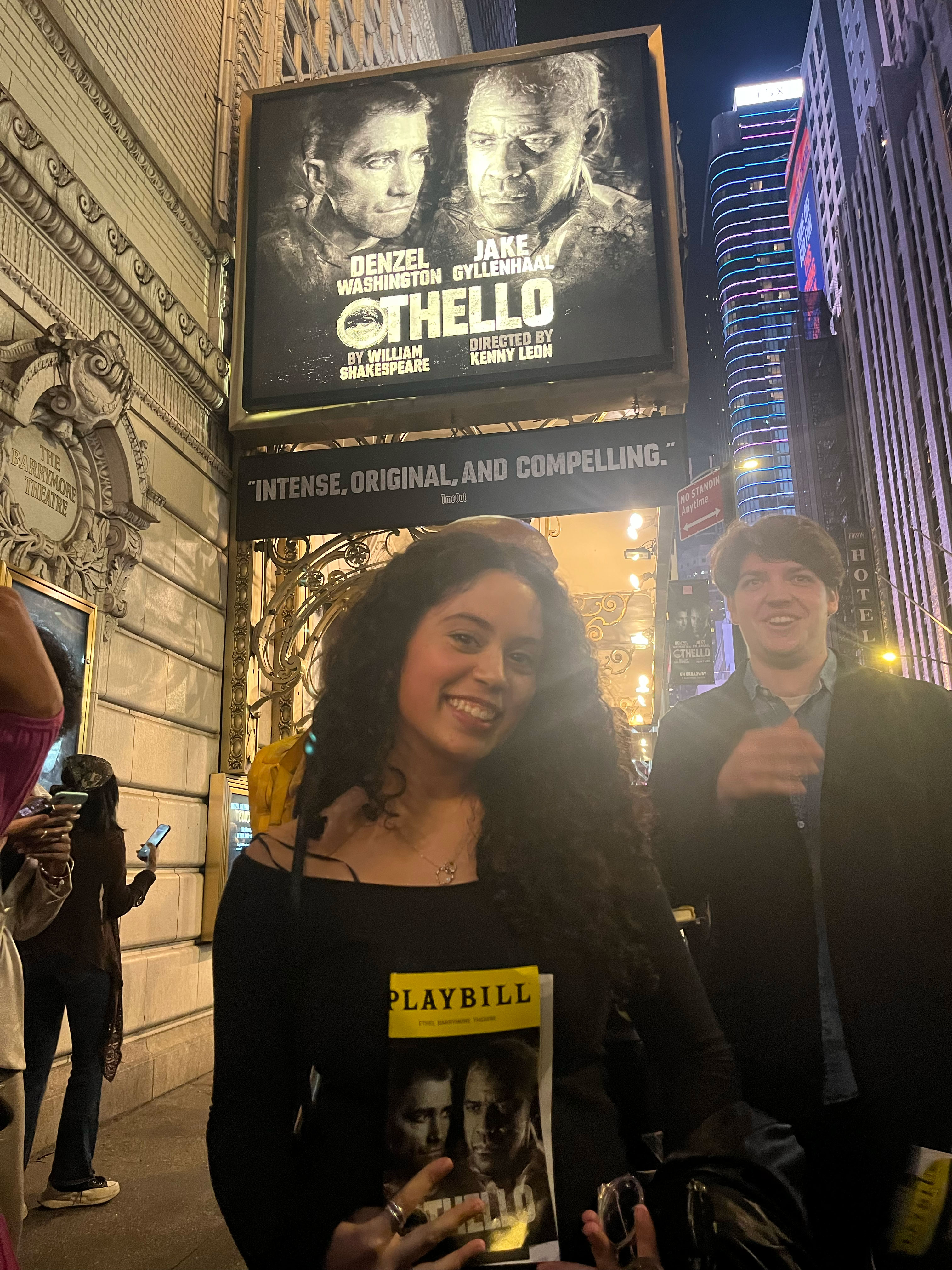 Isabelle Diaz poses with the marquee of Othello on Broadway