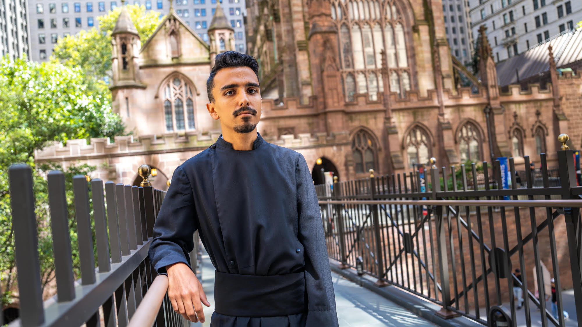 John Garza stands outside of Trinity Church