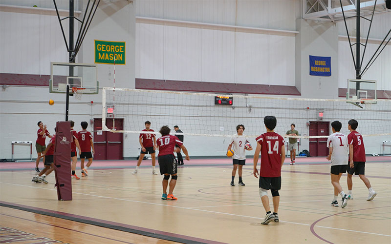 A picture of the men's volleyball team warming up