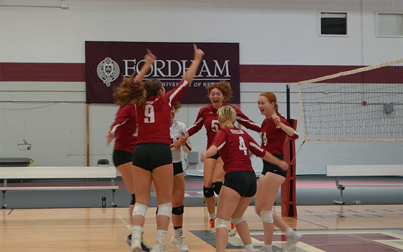 Wome's volleyball team celebrates a point
