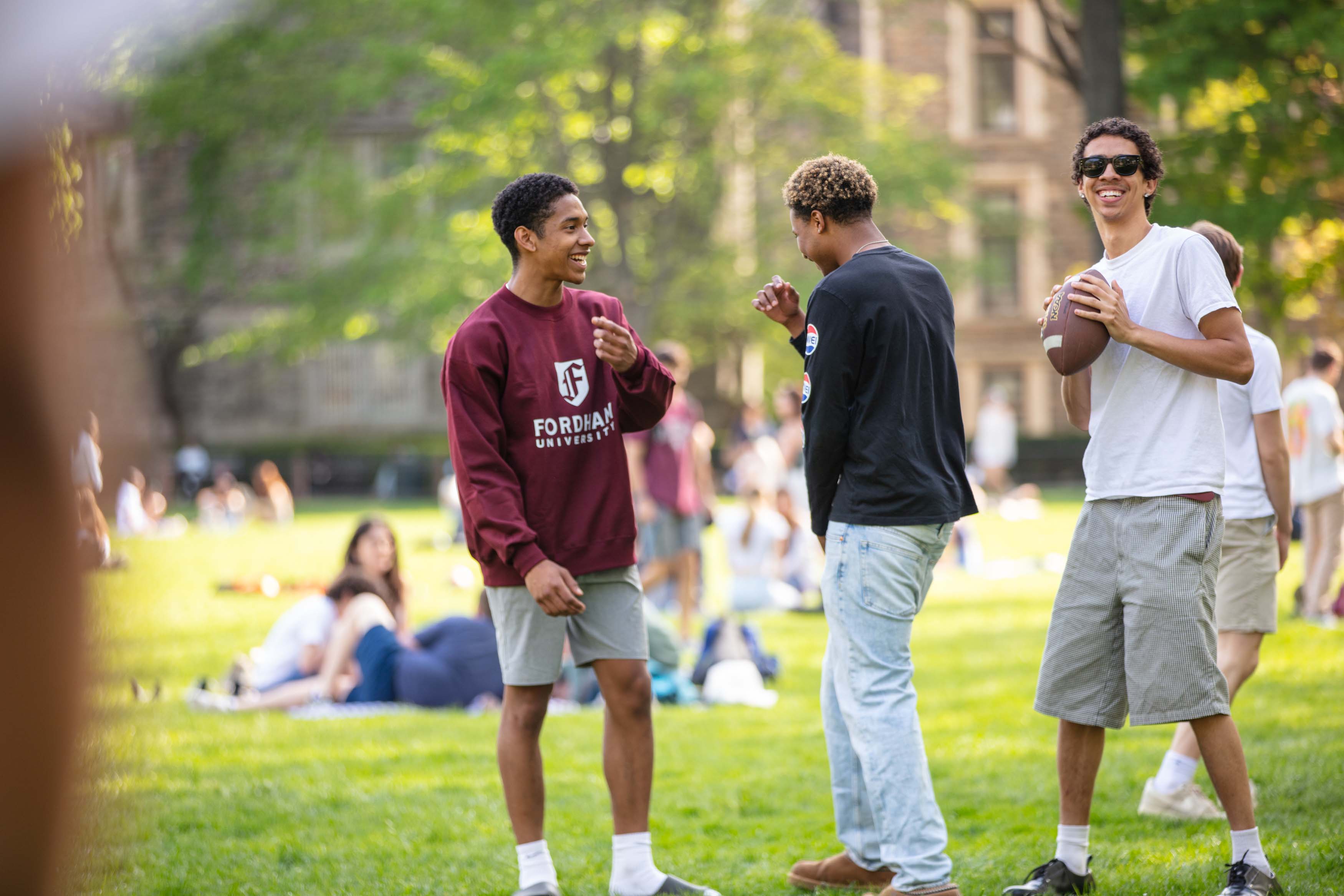 students playing football on Edwards Parade