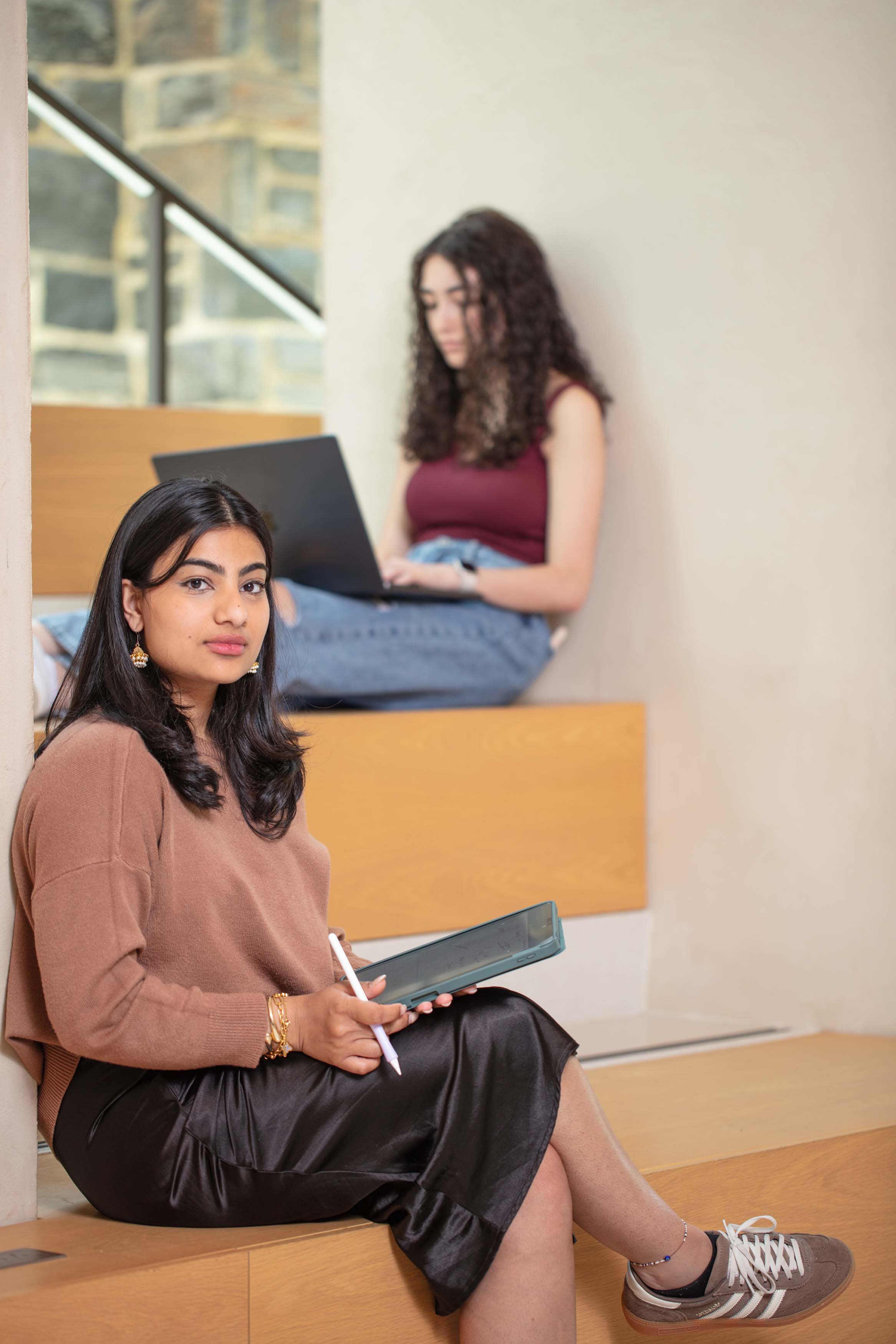 students with ipad and laptop
