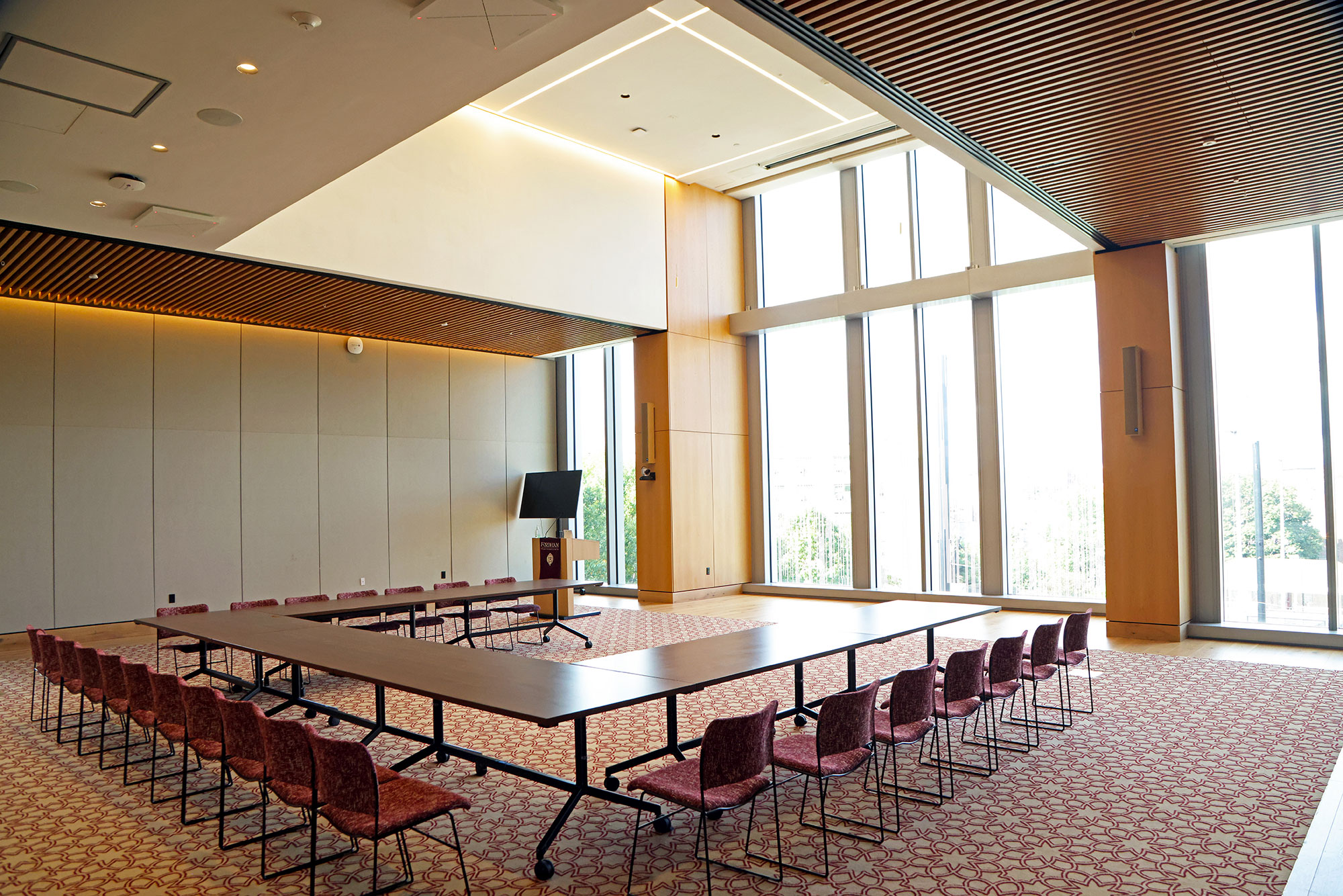 Tables arranged in a square in a large multi-purpose commons area