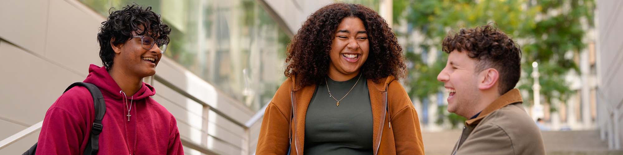 Three students talking at the Lincoln Center campus