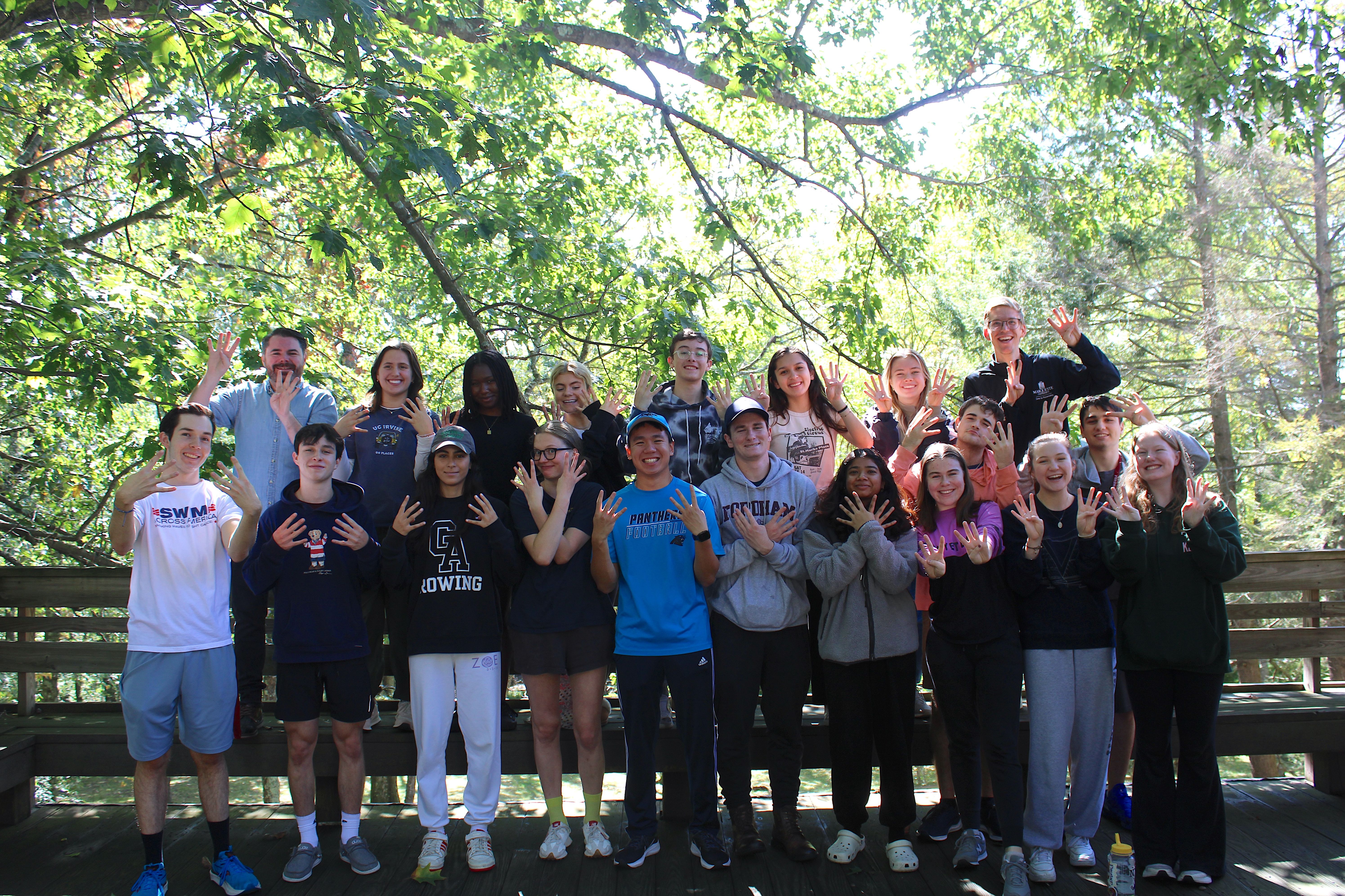 students by tree in retreat