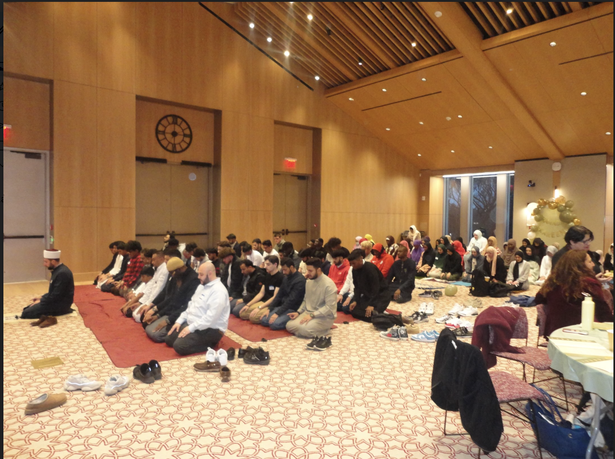 Muslims worshipping and praying on a yoga mat