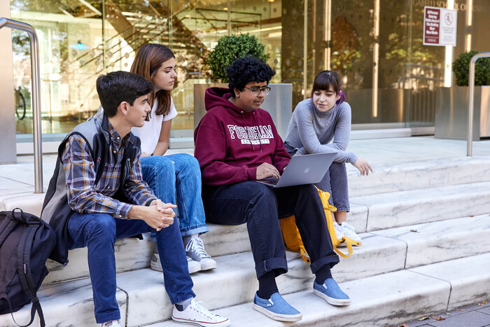 Students sitting on steps