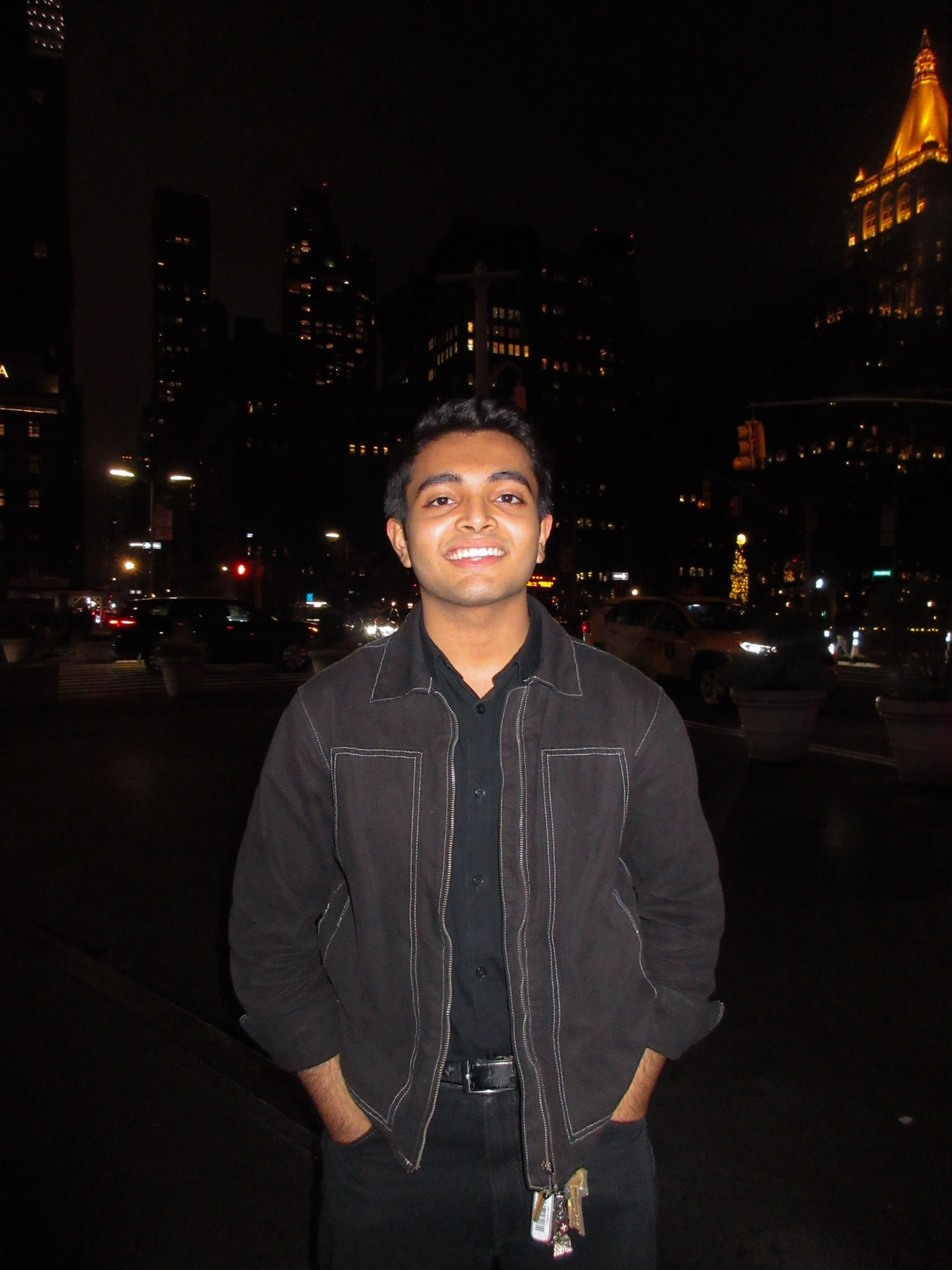 Armughan standing in the night time in a dark jacket