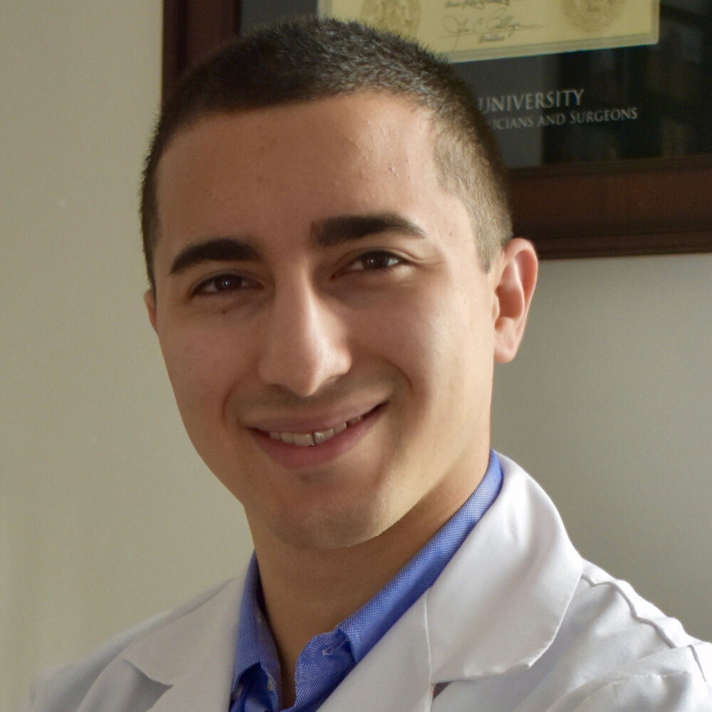 Young man in lab coat.