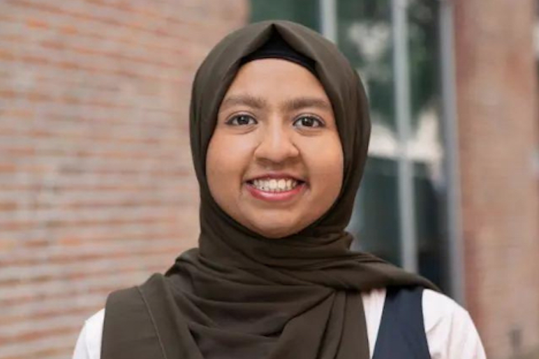 young woman smiling.