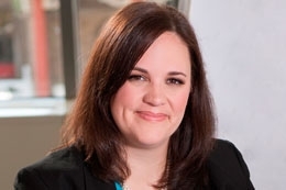 Headshot of young woman with brown hair.