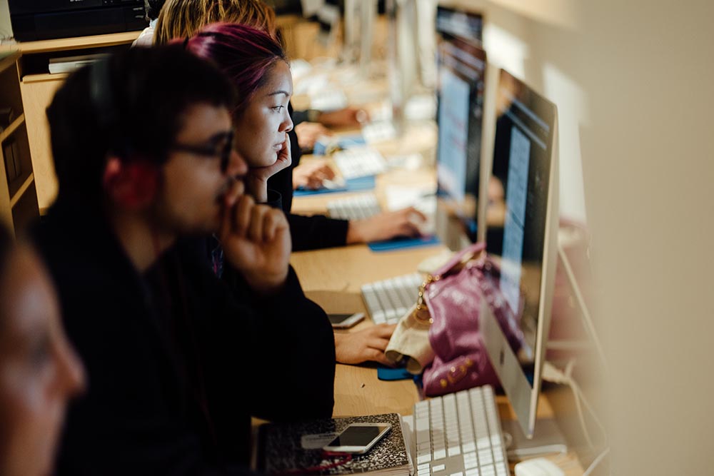 Students on computer during a visual arts class