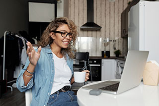 GSAS Female sitting at Computer Coffee Chat