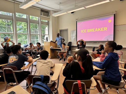 young students in a classroom with the word 