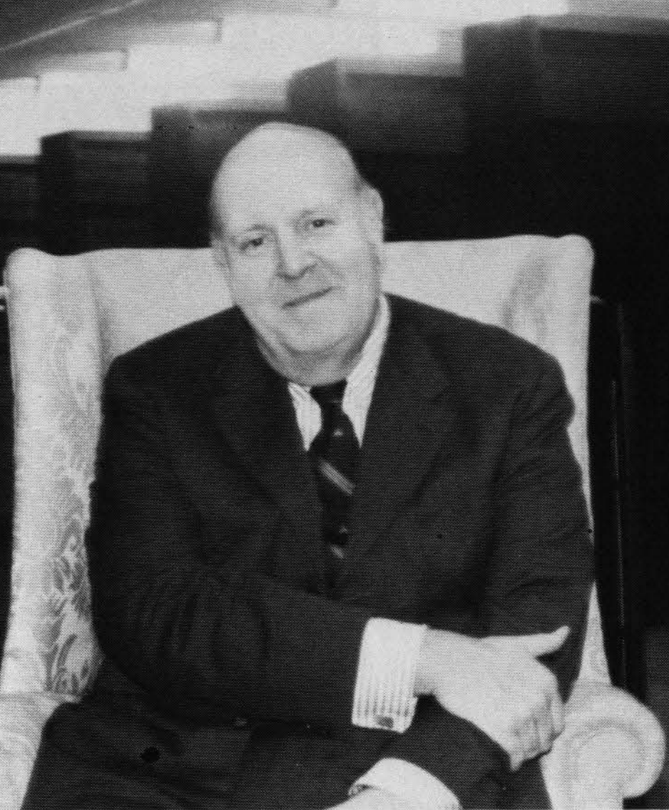 Fordham Law Professor Joseph C. Sweeney sitting in arm chair