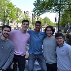 Five students stand in Amsterdam